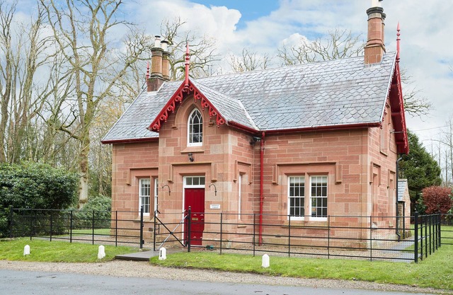 Beautifully restored former gatehouse standing proudly at the entrance