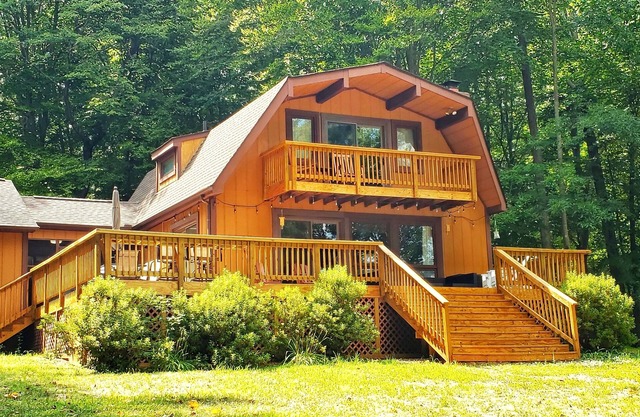 Beautifully situated lakefront house with private dock/boat house/fire pit/views