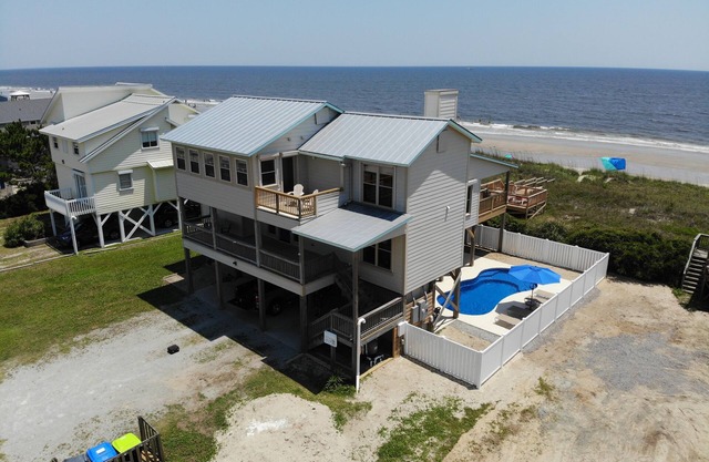 Become an AQUAHOLIC in this oceanfront, dog friendly home on Oak Island!