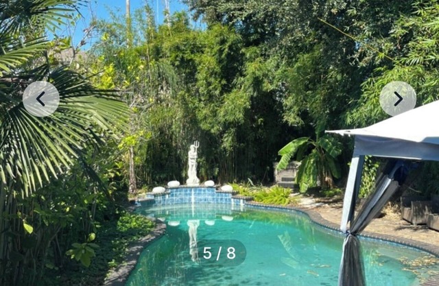 bedroom and en suite bath in historic New Orleans home with pool & WiFi