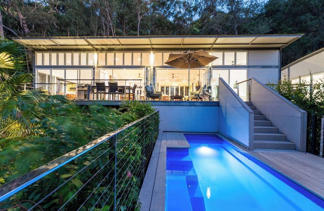 Elegance, architecture and water Views amid Native Tree Tops and Private Grounds