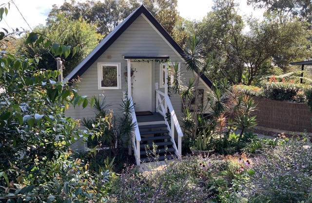 BIRDSONG Stylish private couples loft with water glimpses through the treetops.