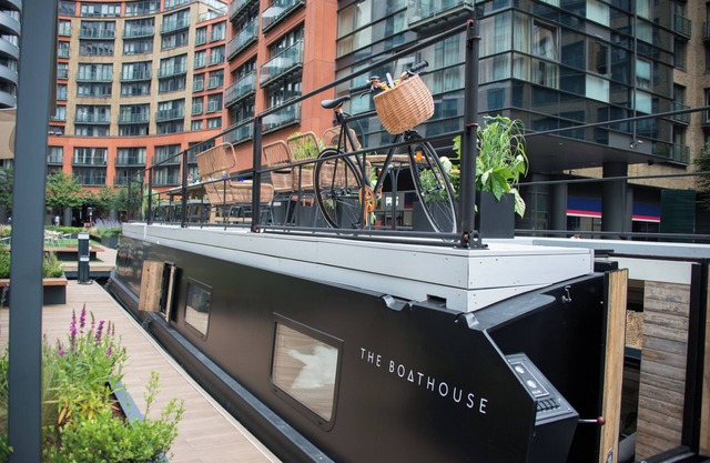 Boutique boat hotel moored on the Floating Pocket Park in West London.