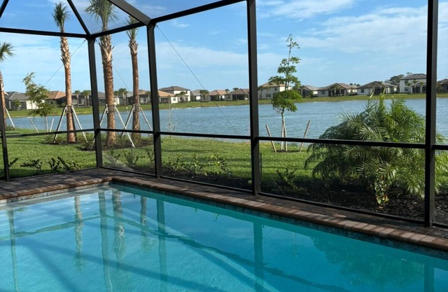 Brand New! 4 Bedroom home with a Heated pool in Gated Community