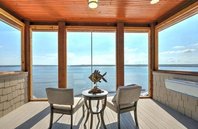 Breathtaking waterfront property with game room and 3 waterfront decks!