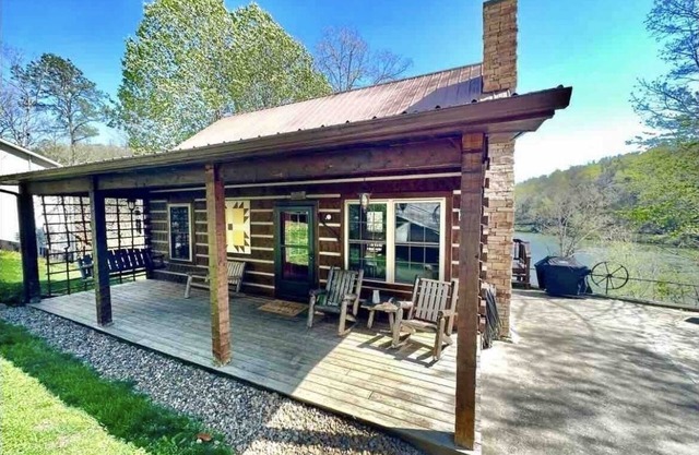 Waterfront lake house with private boat dock, game room, kayaks, and fire-pit.