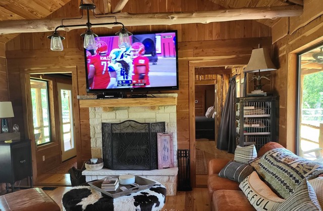 Cedar Acres offers a 3 Bedroom Log Cabin that overlooks a pond.
