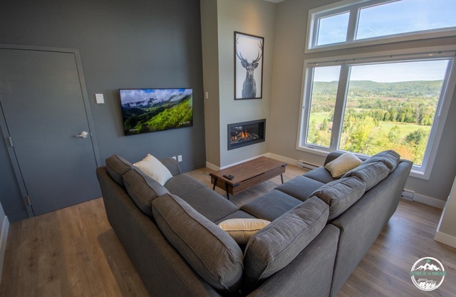 Chalet avec foyer et spa en montagne, vue sur le golf