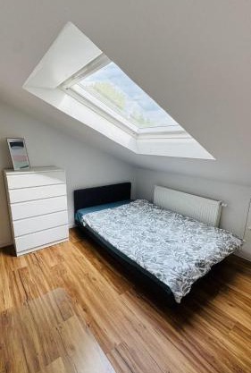 Charming Attic Retreat with Sloped Roof