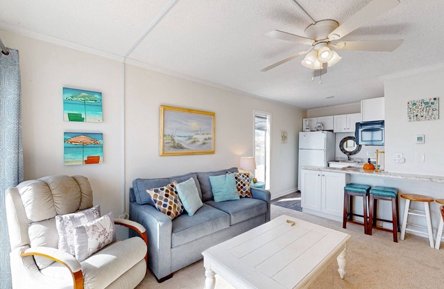 Cheerful beachfront condo with balcony, tennis court, & W/D - snowbird-friendly