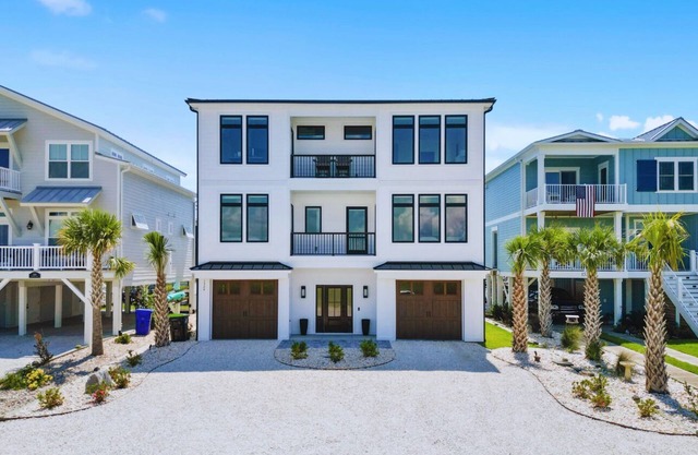 Chic Custom Built Home Encapsulated By Gorgeous Water Views on Sunset Beach