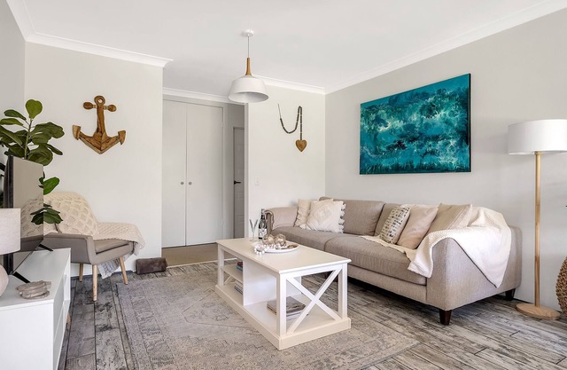 Chic designer garden apartment moments from beach!