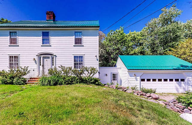 Classic waterfront retreat with a grill, firepit, four bedrooms, W/D, and AC