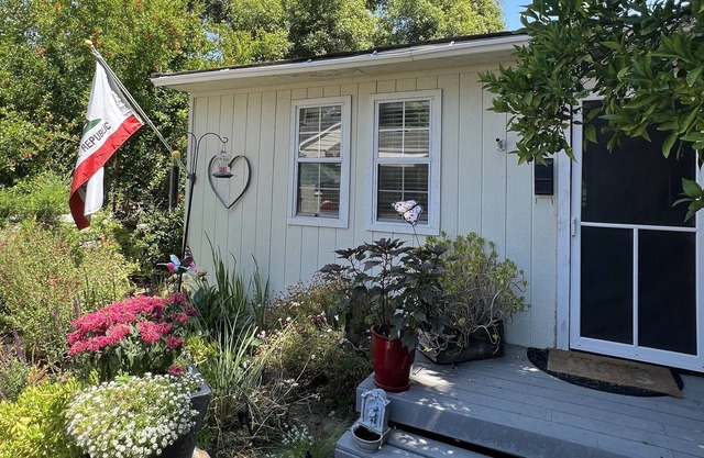 Close to downtown, with beautiful gardens, sparkling pool & private entry