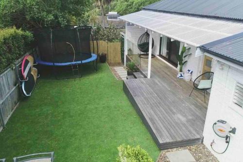 Coastal 3 bedroom house with private oasis.