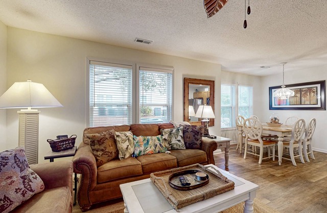 Coastal Condo with golf course view and shared pool access