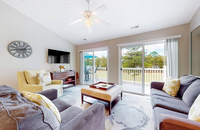 Coastal condo with golf course views, on-site pools, gym, & balcony