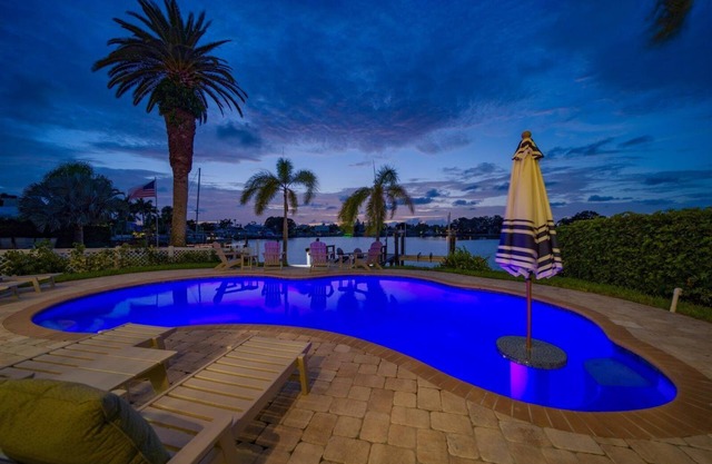 Coastal Elegance: Retreat with Heated Pool, Golf Cart, and Entertainment Haven