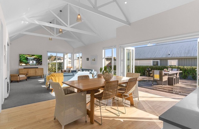 All Decked Out - Modern holiday home with multiple decks including a covered outdoor entertaining space with open fireplace and plastic blinds. Close to shops, cafe, golf course, estuary and Mangawhai Activity Zone. Pet Friendly.