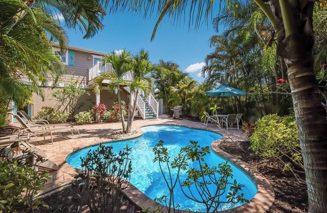 Coastal home with pool and tropical landscaping!
