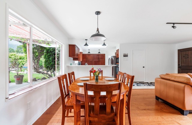 Coastal ranch-style home in garden setting.