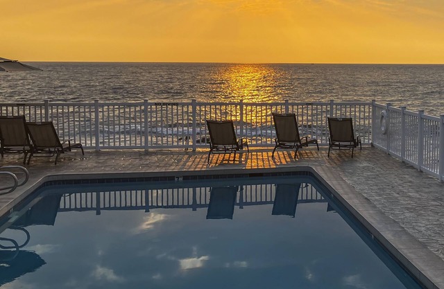 Condo at oceanfront resort with lanai, pool, grill & sundeck - walk to beach