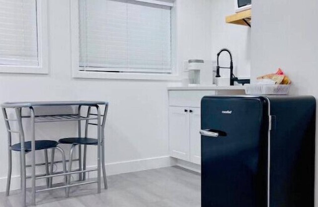 Convenient sunny kitchenette with garage near mountains, lakes, and Highways.