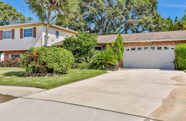 Conveniently located home with pool, Ping-Pong, screened patio, grills, & W/D