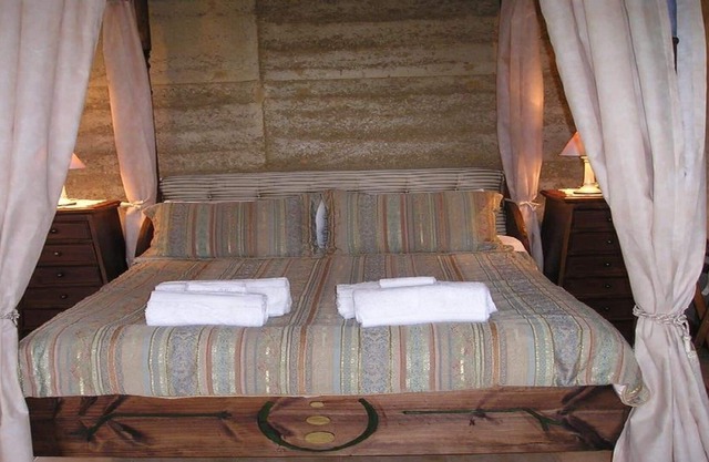 Appartement villa à baldaquin avec spa, feu de bois et propre barbecue sur véranda privée