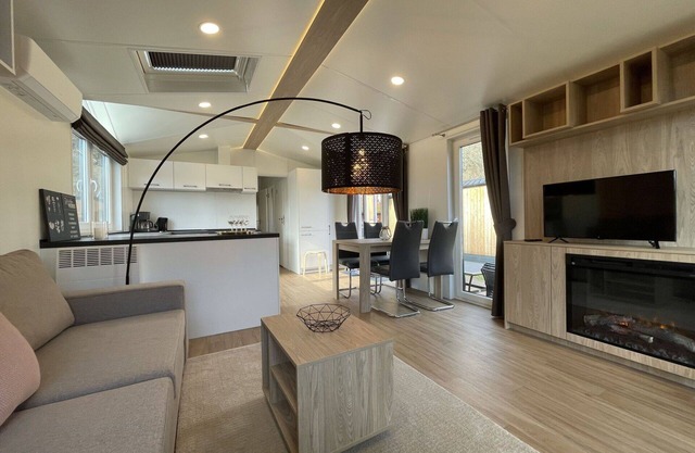 Joli appartement dans une maison de vacances avec climatisation, WIFI, TV, terrasse et parking