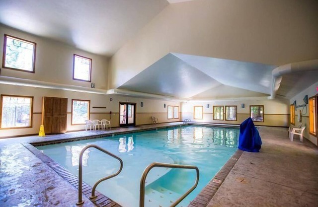 Cozy 2 bedroom condo with wood burning fireplace, private deck and pool/hot tub access