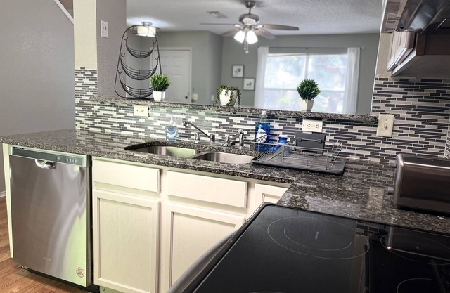 Cozy 4-bedroom home with large backyard for pets.