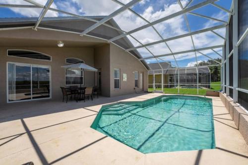 Cozy 4BR Pool Home with Game Room Near Disney villa