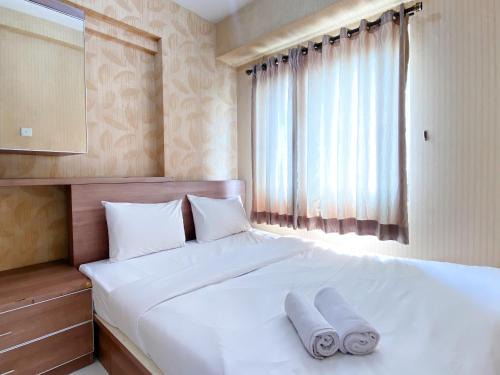 Cozy and Minimalist 2BR at Mutiara Bekasi Apartment By Travelio