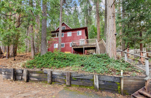 Cozy Blue Lake Springs cabin w/ big trees, decks, game room, and private W/D
