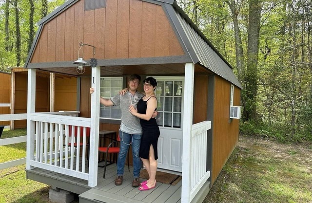 Three one room cabins with common bathhouse are available to book individually.