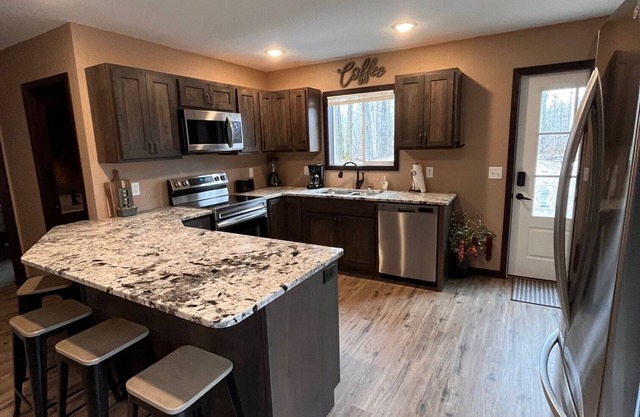 Cozy two level home - 2 minutes from beach on private wooded lot.