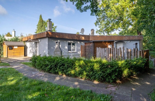 Maison de vacances moderne dans un endroit calme sur le lac, avec cheminée, animaux acceptés