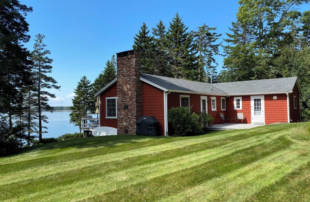 Cozy waterfront cottage overlooking Muscongus Bay with stunning sunset views.