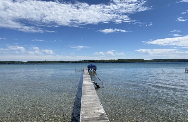 Crystal Lake Waterfront Cottage with Private Dock, Yard, & Hot Tub
