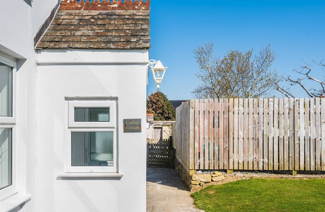 Curlew Cottage, Cubert, with glimpses of the sea