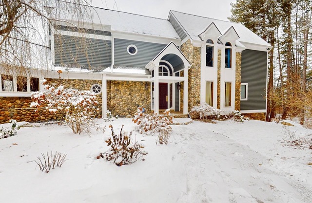 Custom dog-friendly home with private swimming area, fireplace, gym, grill, deck