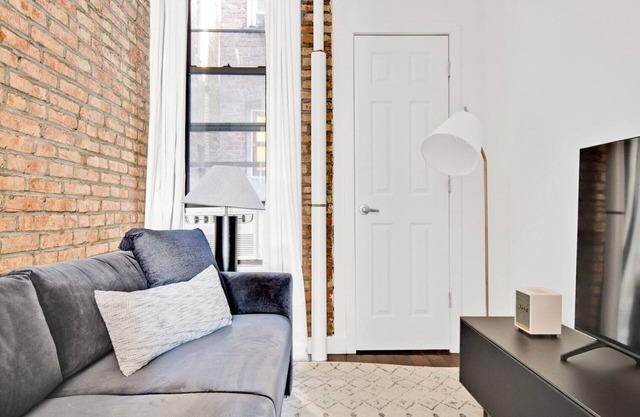 Deluxe LES 1BR w/ W/D, steps to B/D Train & Park, by Blueground