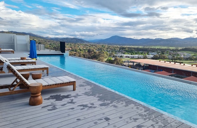 Modern designer gem with access to complex pool, spa, sauna and rooftop park.