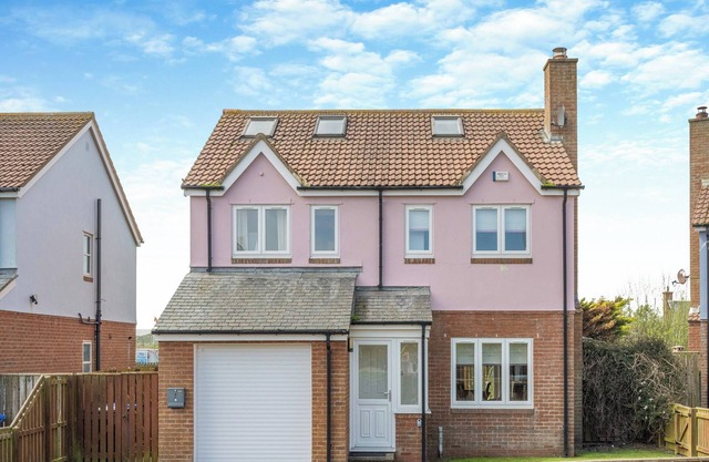 Discover coastal bliss at The Dunes, your perfect family haven by Beadnell Bay.