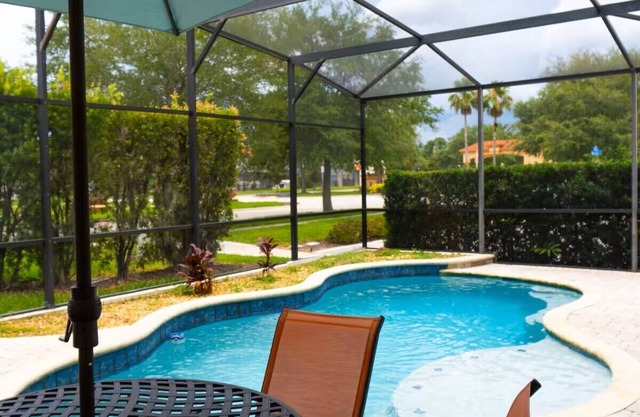 Disney 4-bedroom house with pool, 3 baths, fitness room, WiFi, resort amenities