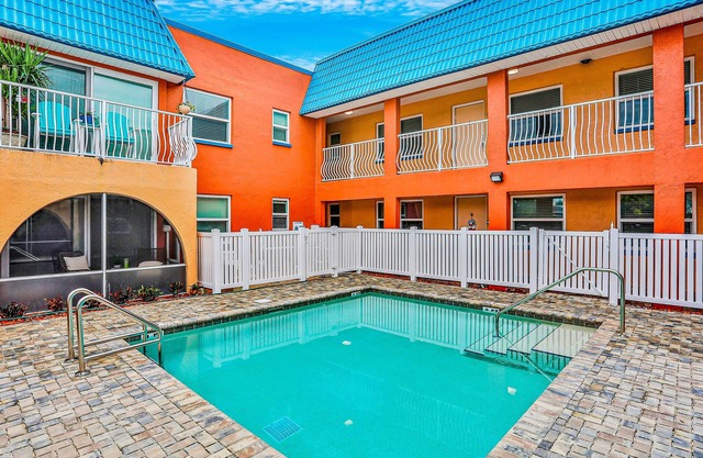 Dog-friendly condo with pool, fitness area, balcony, fast WiFi, & W/D