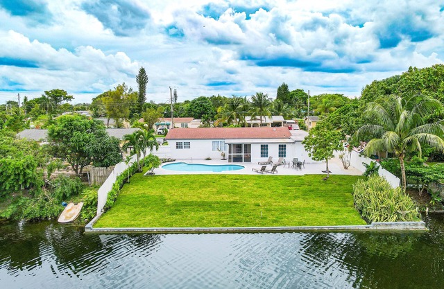 Dog-friendly canal-front home with pool, foosball, washer/dryer, & central AC
