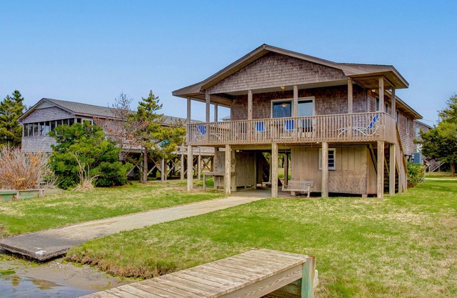 Dog-friendly, canal-front house with dock, balcony, deck, & central AC