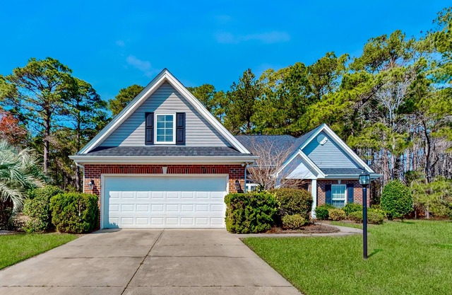 Dog-friendly coastal home with lovely patio, pool, & games - near beaches & golf